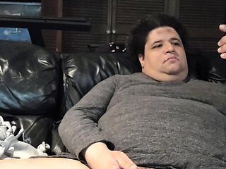 Bored fat trans playing on couch