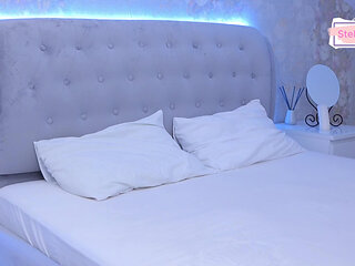 Pours oil on breasts for massage