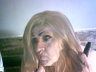 Ugly old sissy spunk bucket slag Sarah tries to make herself attractive to men by applying makeup to her ugly slag face