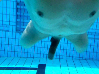 Indoor public pool solo uncut nude fit man swimming