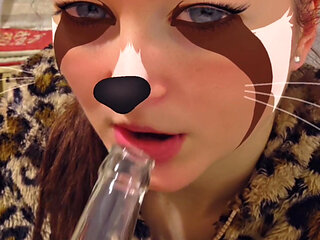 The perverted girl sucks a bottle...