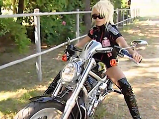 This Beautiful Biker Shows You the Curves of Her Body and Those of Her Motorbike