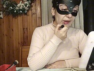 Maggy Applies Lipstick