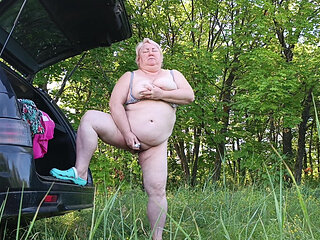 Masturbating Her Pussy in Nature