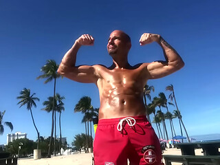 BICEP FLEXING AT THE BEACH