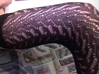 Brunette German slut in stockings fucks herself with orange dildo