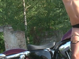 Fabulous brunette enjoys posing outdoors