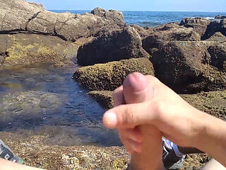 Jerking off a Big Hard Dick Overlooking the Sea in the Beach Cove Until He Cums