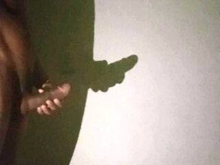 Shadow art in the dark night: the reflection of my private desire of jerking off on the wall.