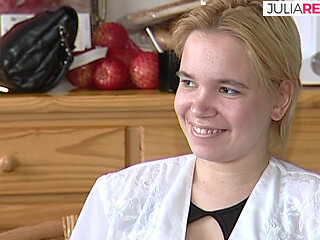 Shy blonde looks down while chatting with lover