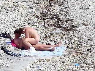 Couple fucked on a public beach while as people walked ...