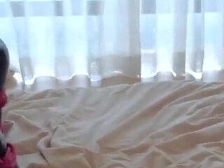 Mz15 - a Puppy Wearing a Latex Suit and Bound by a Red Rope.