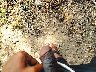 Hairy black indian cock pissing outdoor.