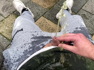 Having a nice warm piss on myself in the backyard