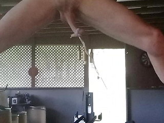 Outside stretching my cock with weights