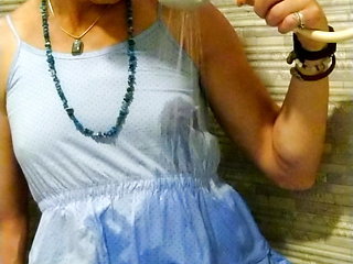 Transgirl wetlook in light-blue summer dress in the sho...