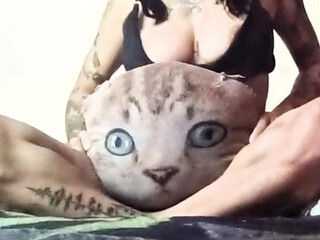 Petite young girl playing alone with a pillow