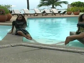 2 sexy Latina's presenting latex fetish in the pool and on the beach