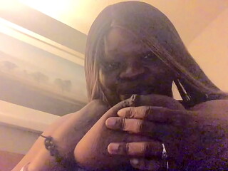 Coco playing with her breast