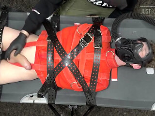 Bondage Twink Strapped to Campbed in Straitjacket and Gas Mask