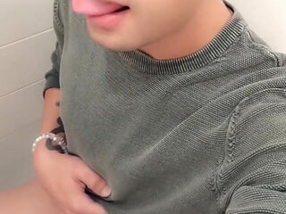 Twink Is Peeing with His Uncut Cock in Sitting Position on a Toilet