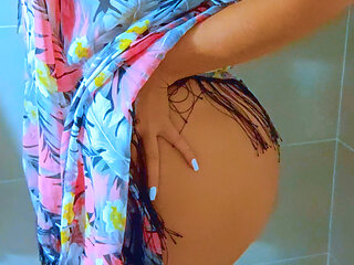 Watch this stunning Brazilian beauty shower in a black string thong