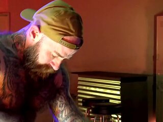 Tattooed stud with lots of tattoos gets a blowjob