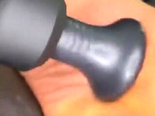 Ebony Girl Gives Her Feet a Massage with a Massage Gun