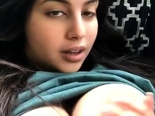 Busty curly brunette with big boobs fucks on couch