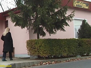 Beauty pissing on street behind bushes