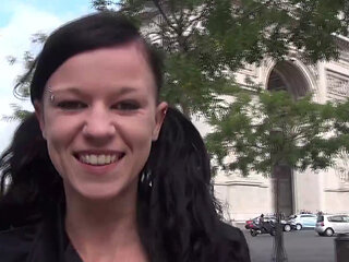 Vanessa , a pretty brunette, shows off on the Champs Elysees