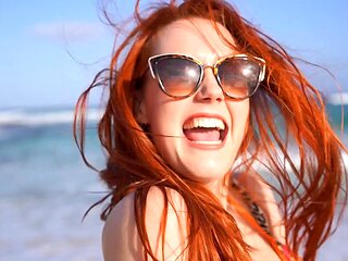 A couple has a passionate doggystyle sex with a redhead