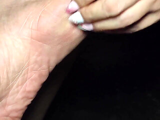 Woman in Heels Scratches Her Feet with Her Fingernails