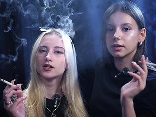 Two Women Smoking Together in a Dark Studio with Soft Blue Lighting