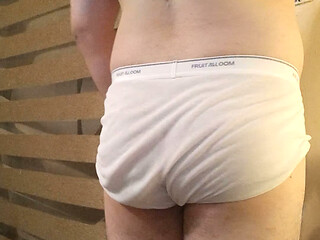 Muscular stud plays with his bulge and nipples