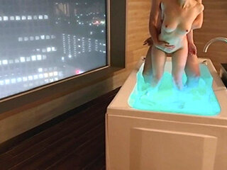 Amateur couple are lovey-dovey in hotel bath with night view. And intense sex with standing back. Japanese amateur hentai
