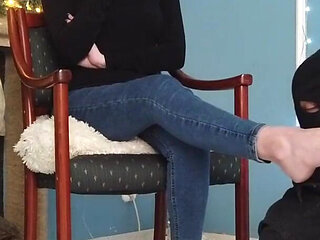 Worshiping the feet of a girl in blue jeans
