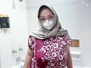 Fountain of a girl in a batik daster dress