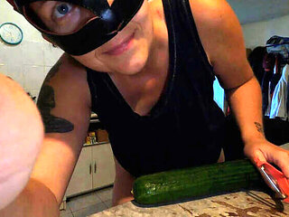 Hot French MILF Kahann masturbates with cucumber in kitchen close-up amateur video