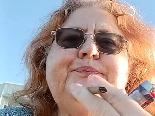 Bearded Lady try's to  lights  on windy beach!