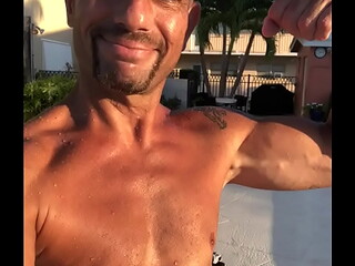 MAXXX LOADZ FLEXING BY THE POOL ON A SUNNY DAY