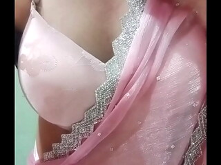 Indian Gay Crossdresser Bottom Gaurisissy Pressing and Playing with Her Big Boobs in Pink Saree with jwellery Looking Like a Housewife
