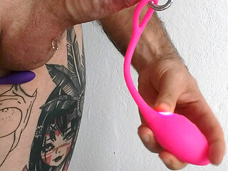 Playing with vibrator on the penis