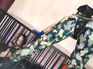 Latex Officer Fucks His Latex Prisoner with a Strap-on