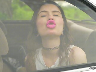 Messy Pink lipgloss marks on the Car Window