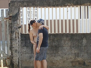 My wife and me dating in front yard