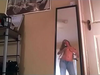 A chubby beauty masturbates her pussy and pees in her pants