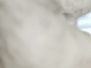 A young man showing his penis to others on bed