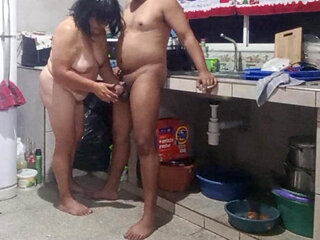 My mother-in-law masturbates me in the kitchen and wants me to fuck her doggy style.