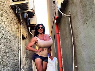 A super sexy brunette massages her big boobs